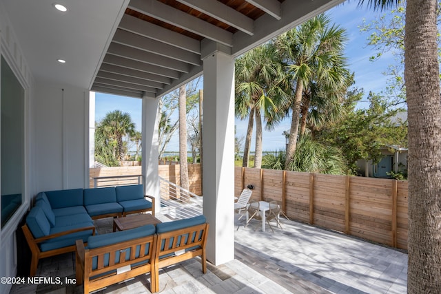 2 Sanchez Cv, Saint Augustine, FL 32080 - wooden terrace featuring an outdoor living space, a fenced backyard, a patio area, and outdoor dining area