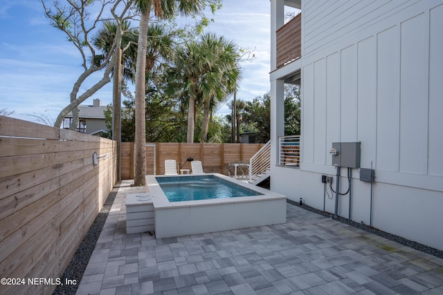 2 Sanchez Cv, Saint Augustine, FL 32080 - view of pool with a hot tub, a fenced backyard, and a patio area