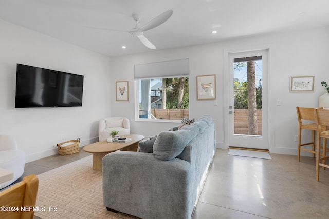 2 Sanchez Cv, Saint Augustine, FL 32080 - living area with healthy amount of natural light, recessed lighting, a ceiling fan, baseboards, and concrete floors