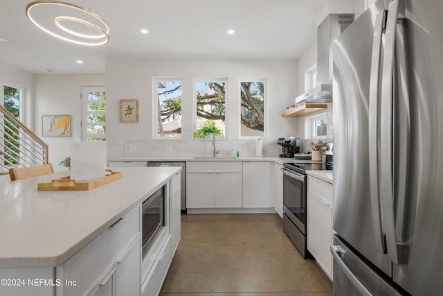 2 Sanchez Cv, Saint Augustine, FL 32080 - kitchen featuring appliances with stainless steel finishes, a sink, decorative backsplash, recessed lighting, and concrete flooring