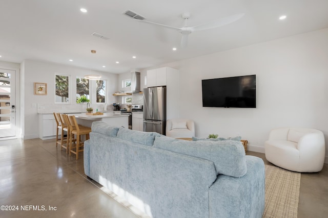 2 Sanchez Cv, Saint Augustine, FL 32080 - living room featuring recessed lighting, concrete flooring, a ceiling fan, and baseboards