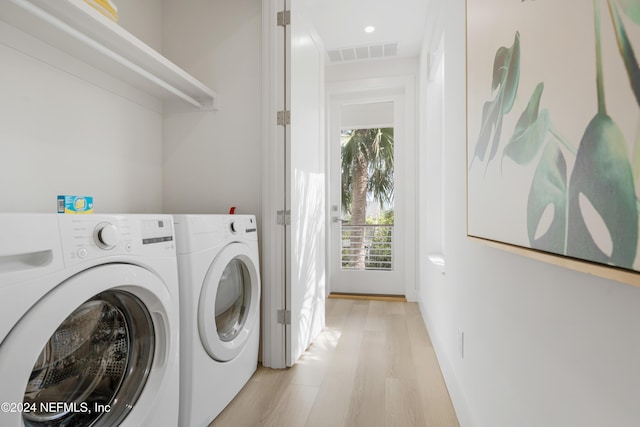 2 Sanchez Cv, Saint Augustine, FL 32080 - laundry area featuring washing machine and dryer, light wood finished floors, baseboards, and recessed lighting