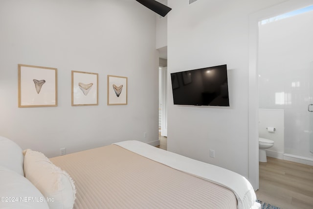 2 Sanchez Cv, Saint Augustine, FL 32080 - bedroom featuring wood finished floors, ensuite bath, and baseboards