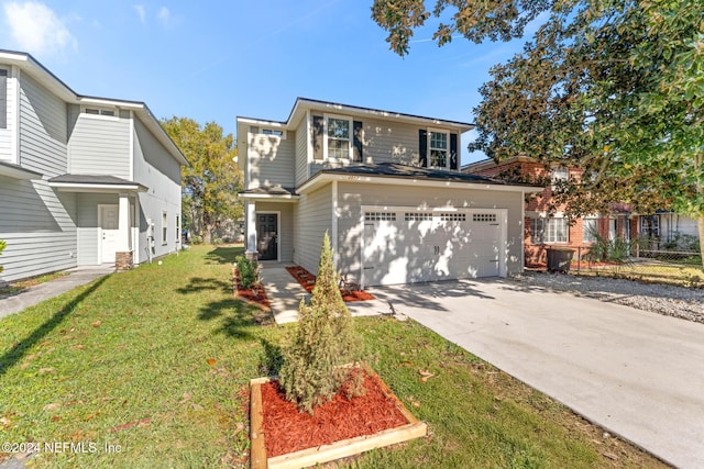 view of property with a front yard and a garage