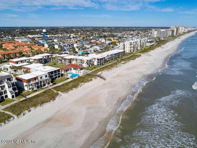 drone / aerial view featuring a view of the beach and a water view