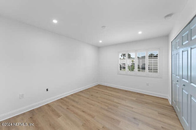 unfurnished bedroom featuring light wood-type flooring