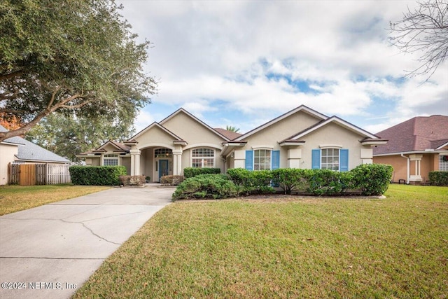 view of front of property with a front lawn