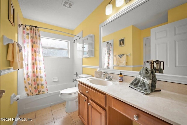 full bathroom with tile patterned flooring, shower / tub combo, vanity, and toilet