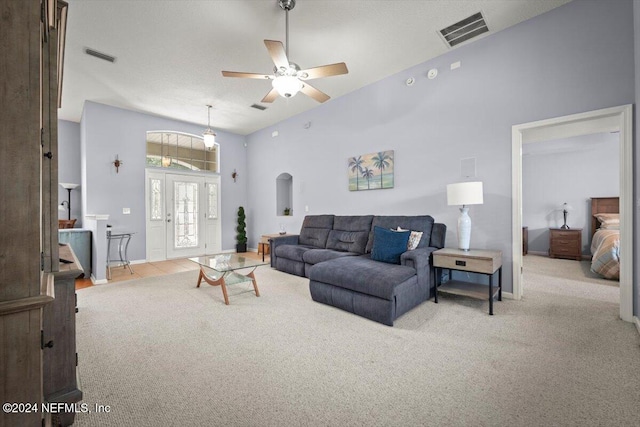 living room featuring light carpet and ceiling fan