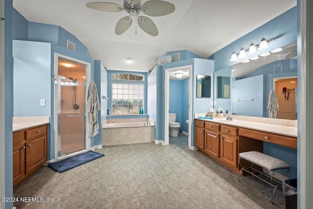 full bathroom featuring vanity, a textured ceiling, separate shower and tub, ceiling fan, and toilet