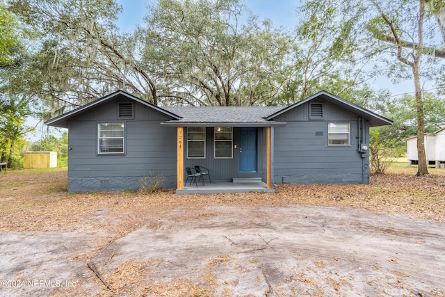 ranch-style home with covered porch