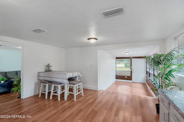 dining area featuring light wood-type flooring