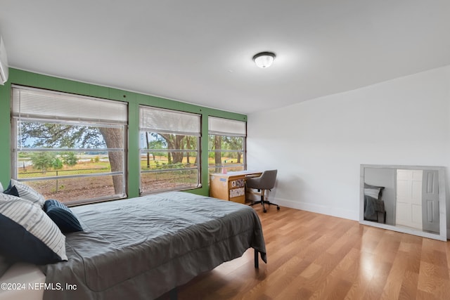 bedroom with light wood-type flooring