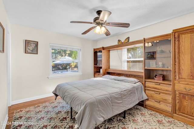 bedroom featuring light wood-type flooring and ceiling fan