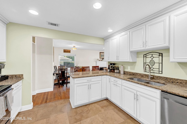 kitchen featuring white cabinetry, kitchen peninsula, sink, and appliances with stainless steel finishes