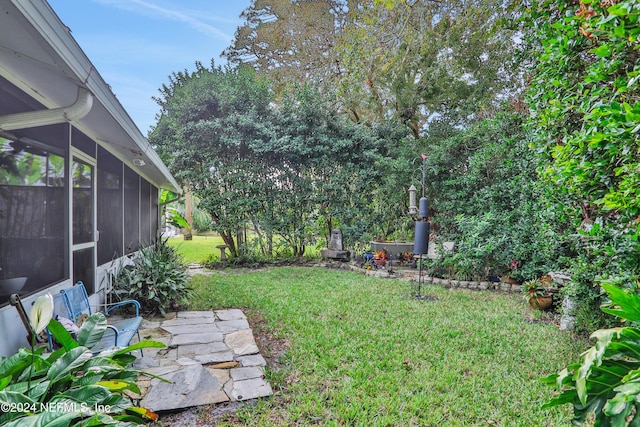 view of yard with a sunroom