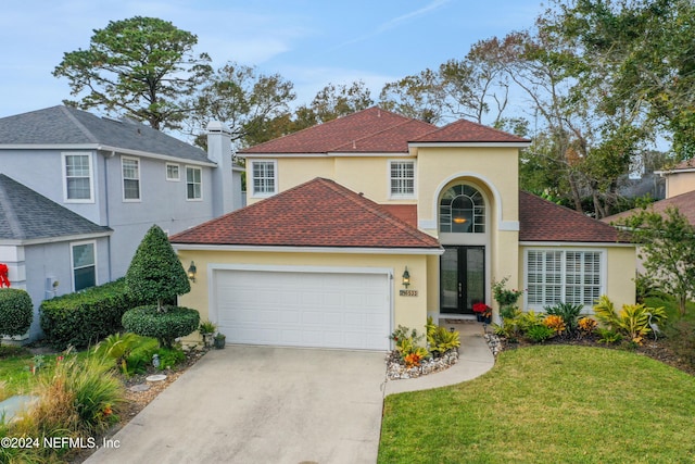 view of front of property featuring french doors and a front lawn