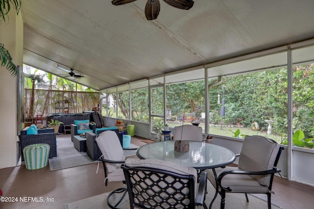 sunroom featuring ceiling fan and lofted ceiling