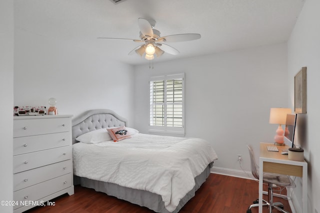 bedroom with ceiling fan and dark wood-type flooring