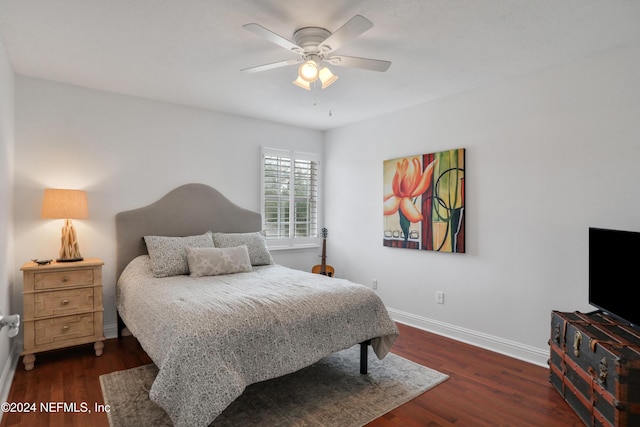 bedroom with ceiling fan and dark wood-type flooring