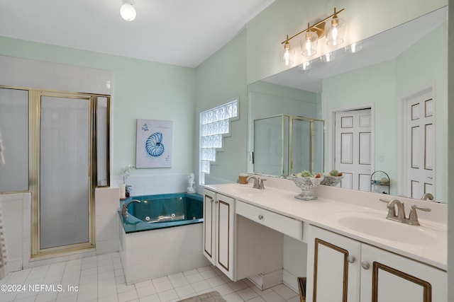 bathroom with tile patterned flooring, shower with separate bathtub, and vanity