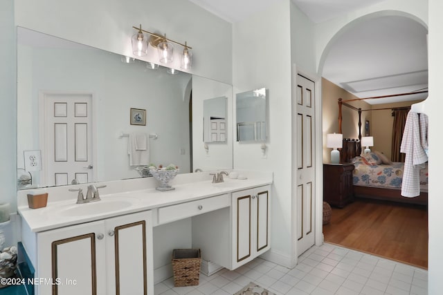 bathroom featuring hardwood / wood-style floors and vanity