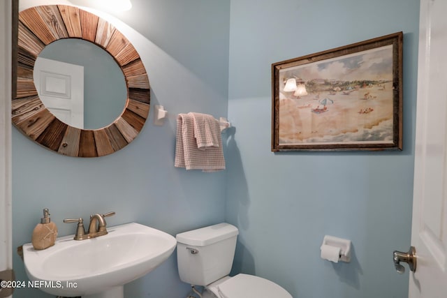 bathroom with sink and toilet