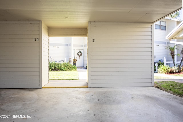 exterior space with a carport