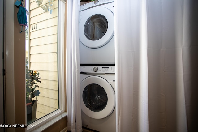 laundry room featuring stacked washer / dryer