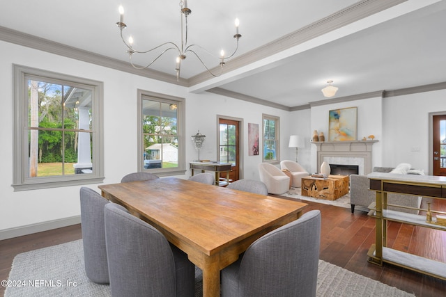 dining area with a wealth of natural light, dark hardwood / wood-style flooring, and crown molding