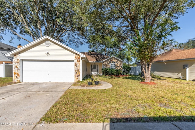 ranch-style home featuring a garage and a front lawn