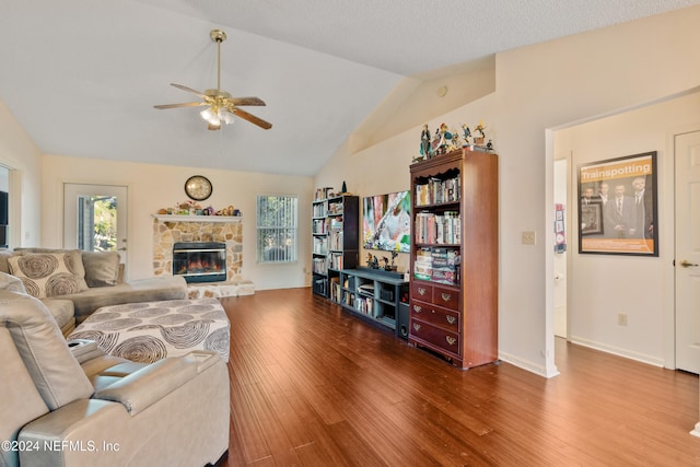 living room featuring a fireplace, hardwood / wood-style flooring, and a wealth of natural light