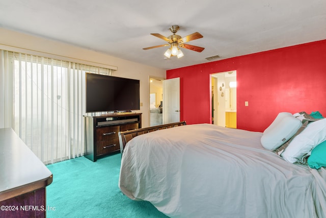 carpeted bedroom with ensuite bath and ceiling fan