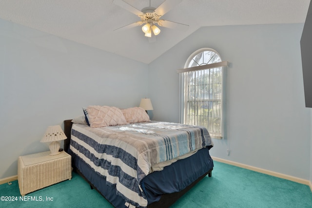 bedroom with ceiling fan, carpet floors, and lofted ceiling