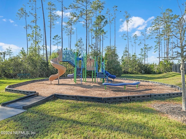 view of playground featuring a lawn