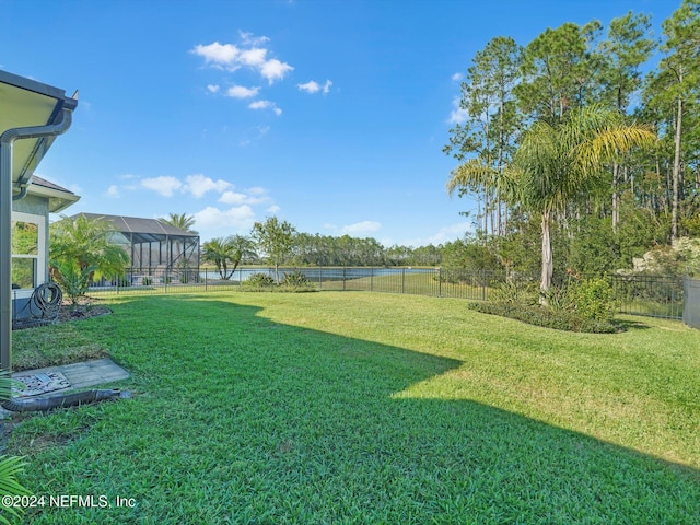 view of yard with a lanai