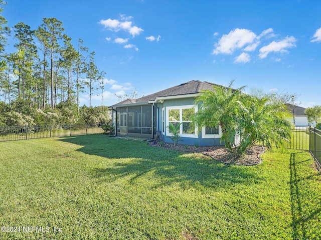 view of yard with a sunroom