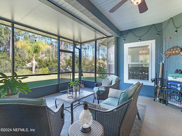 sunroom featuring ceiling fan