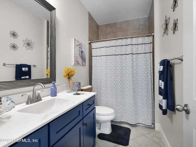 bathroom featuring vanity, tile patterned floors, toilet, a textured ceiling, and walk in shower