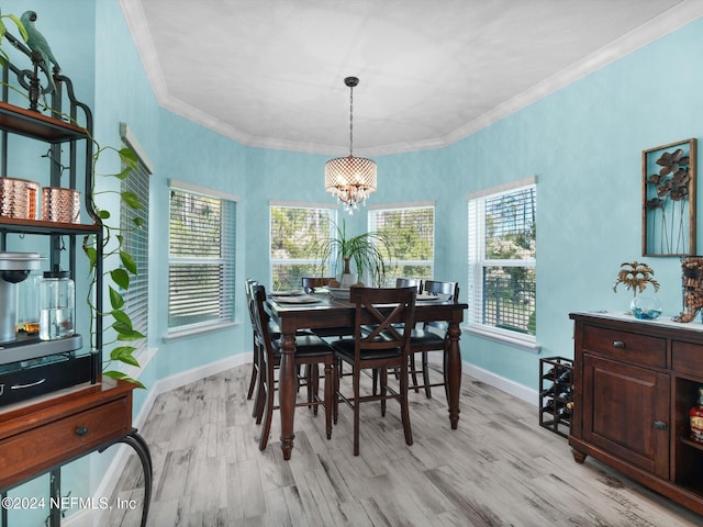 dining area with plenty of natural light, light wood-type flooring, and a chandelier