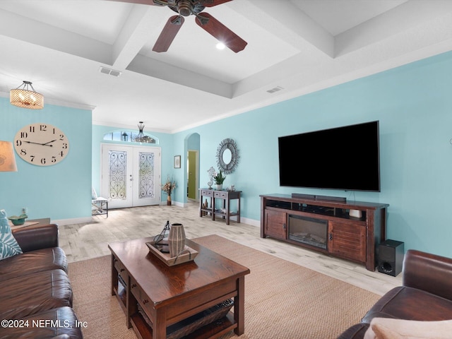 living room with french doors, ceiling fan, crown molding, beamed ceiling, and light hardwood / wood-style floors