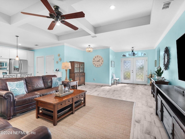 living room with light wood-type flooring, ornamental molding, and french doors