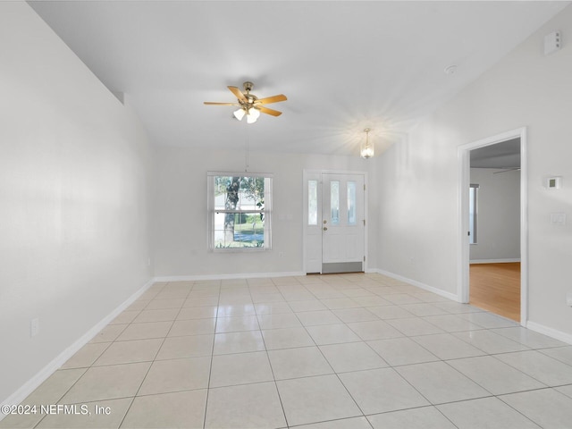 empty room featuring light tile patterned floors and ceiling fan