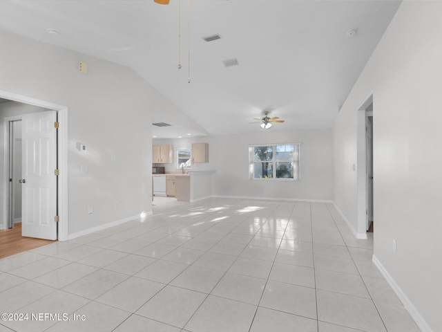 unfurnished living room with sink, ceiling fan, lofted ceiling, and light tile patterned flooring