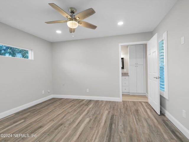 empty room featuring hardwood / wood-style floors and ceiling fan