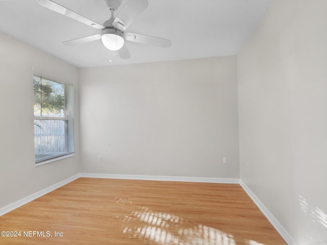 unfurnished room featuring ceiling fan and hardwood / wood-style floors