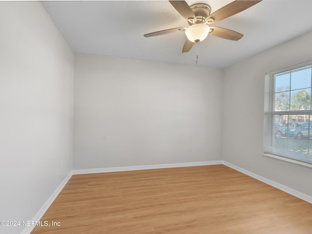 spare room with light hardwood / wood-style floors and ceiling fan