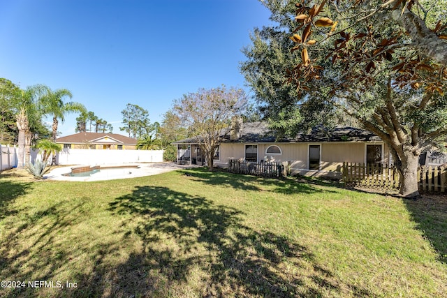 view of yard with a patio and a fenced in pool