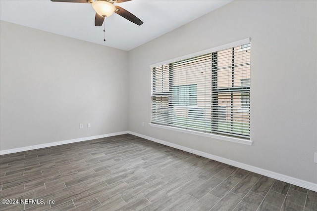 empty room featuring hardwood / wood-style flooring and ceiling fan