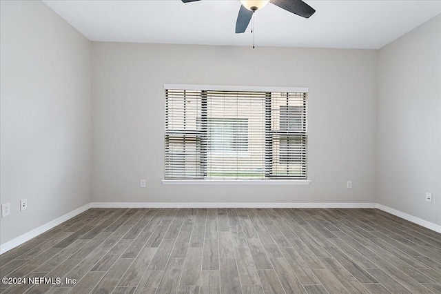 unfurnished room with wood-type flooring and ceiling fan